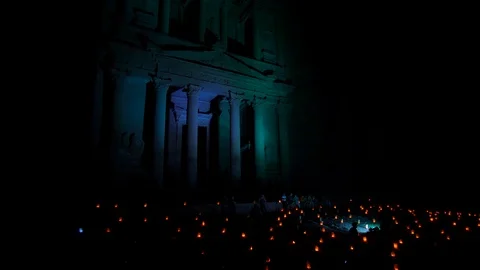 Night walk through. The treasury of Petra is seen by night Stock Footage 126242567