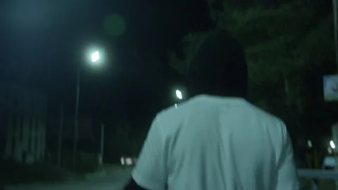 Night Walk — Young Athlete on Empty Street Stock Footage 314644375