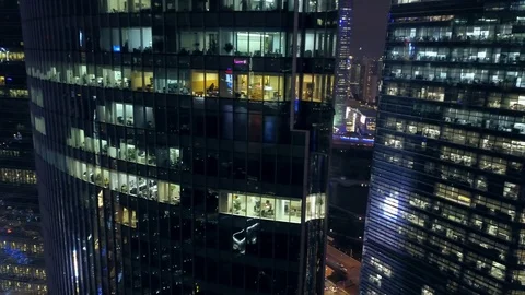 Night window office building skyscraper people work business Shanghai Helicopter Stock Footage 90365141