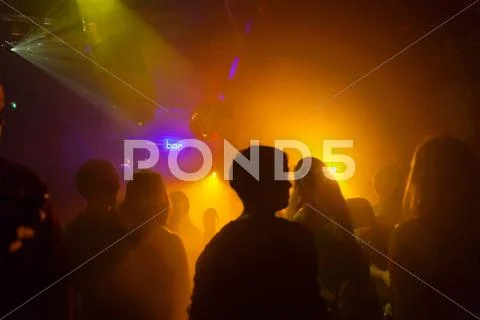 Nightclub Scene With People Dancing, Disco Ball, Lighting Equipment