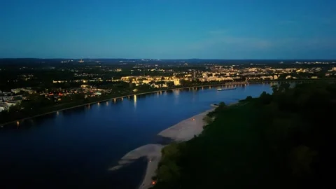Nightfall aerial view of Cologne riverside with tents, campfire and city lights Stock Footage 309233724