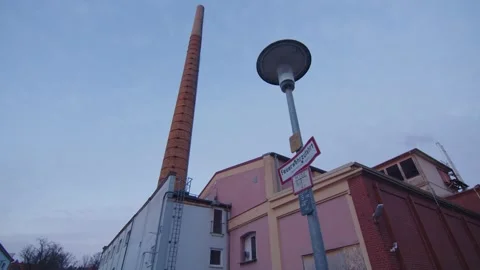 Nightfall in an industrial area with an old chimney, Frankenjura, Germany Stock Footage 293565214