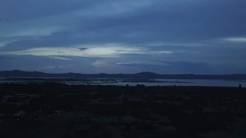 Nightfall over a Myanmar landscape by a river Stock Footage 95673097