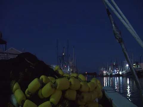 NIGHTIME SKY ON BOAT WITH NETS AND BUOYS Stock Footage 76584798