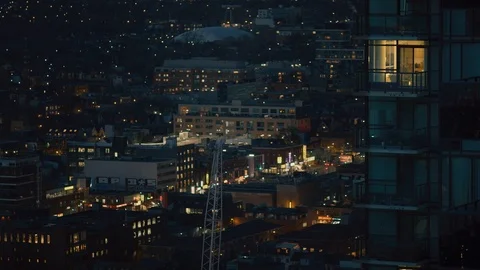 Nightime Skyline with city with rack focus Stock Footage 101433331