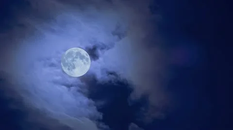 Nightly cloudy moving sky with large moon time lapse Stock Footage 10821655