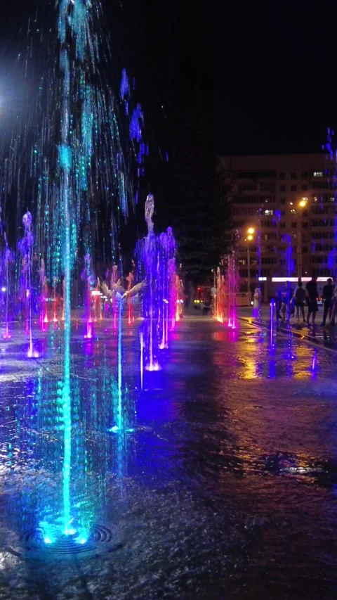 Nightly fountain with multi-colored illumination, night. Horizontal video Stock Footage 158599337