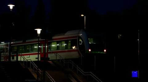 Nightly train leaving Stock Footage 38005686