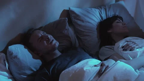 Nightmare anxiety night terror disturbed man bed Stock Footage 151737698