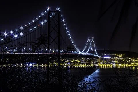 Nightscape at the 25 of April Bridge Stock Photos