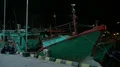 Nightshot boat people and fisherman ship in a domestic indonesian harbor HD Footage