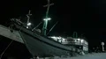 Nightshot simple wooden freight ship in a domestic indonesian harbor HD Footage
