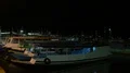 Nightshot tour boats anchored close up in a domestic indonesian harbor HD Footage