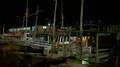 Nightshot tour boats anchored close up in a domestic indonesian harbor HD Footage