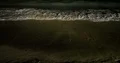 Nightshot water waves at the sandy beach in the dark night 4k+ 4k or 4k+ Resolution
