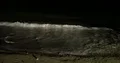 Nightshot water waves at the sandy beach in the dark night 4k+ 4k or 4k+ Resolution