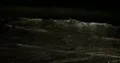 Nightshot water waves at the sandy beach in the dark night 4k+ 4k or 4k+ Resolution