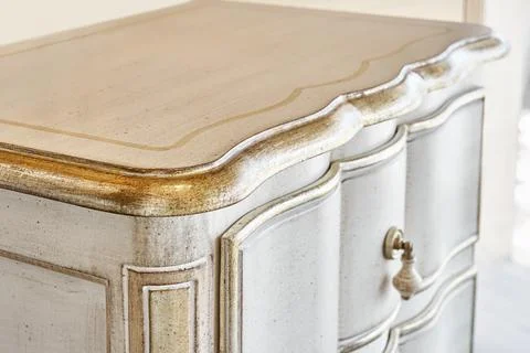 Nightstand in classical style with open drawer in room Foto stock