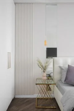 Nightstand table in bright apartment Fotos Stock