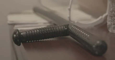 Nightstick on Desk 4K Stock Footage 146247126