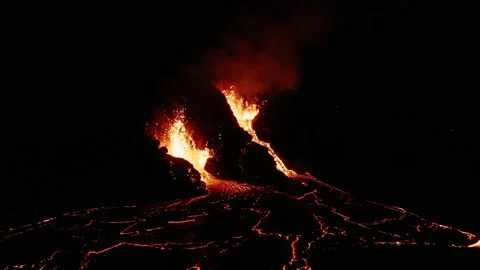 Nighttime at active effusive volcano with exploding magma from earth mantle Stock Footage 151647253