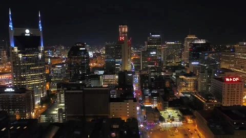 Nighttime aerial flight over downtown Nashville Tennessee with city lights Stock Footage 344530365