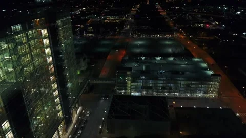Nighttime aerial flight over downtown Tulsa Oklahoma with bright city lights Stock Footage 344722301