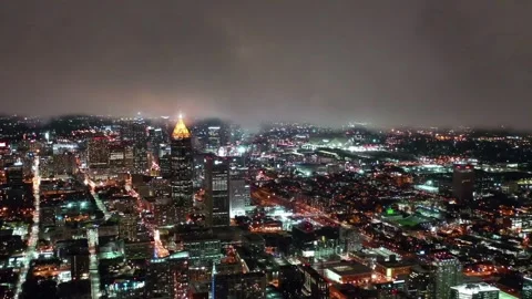 Nighttime aerial flight over downtown Atlanta, Georgia capturing city lights Stock Footage 344733929