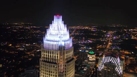 Nighttime aerial flight over downtown Charlotte North Carolina, city skyline Stock Footage 344779326