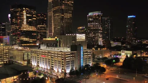 Nighttime aerial flight over downtown Charlotte North Carolina and skyscrapers Stock Footage 344779337