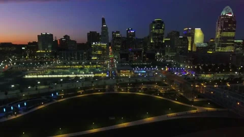 Nighttime aerial flight over downtown Cincinnati Ohio capturing city lights Stock Footage 344779977