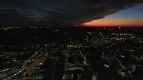 Nighttime aerial flight over downtown Cincinnati Ohio with bright city lights Stock Footage 344779994