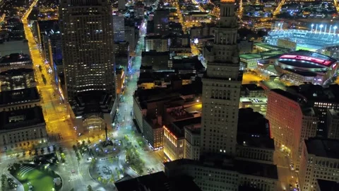 Nighttime aerial flight over downtown Cleveland Ohio with amazing skyscrapers Stock Footage 344780522