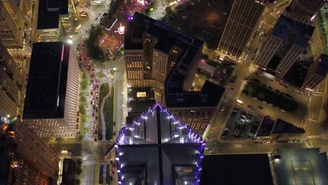 Nighttime aerial flight over downtown Detroit Michigan capturing city lights Stock Footage 344787312
