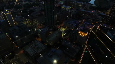Nighttime aerial flight over downtown Fort Worth Texas capturing city lights Stock Footage 344790550