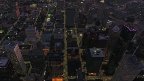 Nighttime aerial flight over downtown Houston Texas with bright city lights Stock Footage 344790968