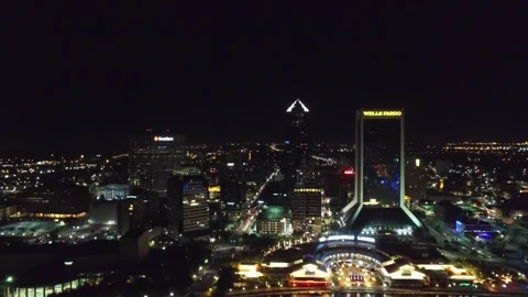 Nighttime aerial flight over downtown Jacksonville Florida with city lights Stock Footage 344793327