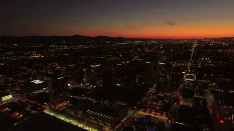 Nighttime aerial flight over Phoenix Arizona showing illuminated skyscrapers Stock Footage 344628070