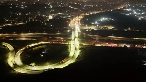 Nighttime aerial view of intersecting roadways Stock Footage 295480521