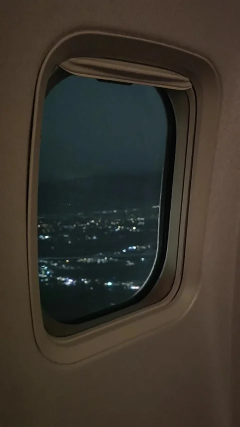 Nighttime aerial view through airplane window Stock-Footage 337537383