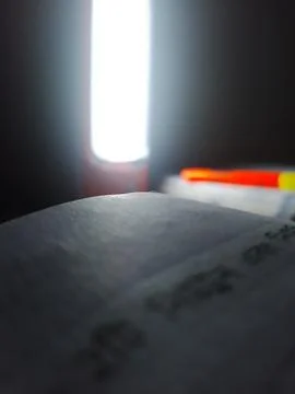 Nighttime Book Study with Electric Light Glow Stock Photos