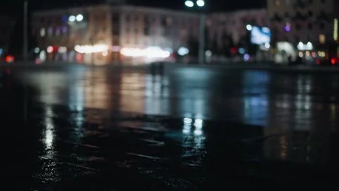 Nighttime Cityscape with Blurred Reflections and Pedestrians Stock-Footage 279075562