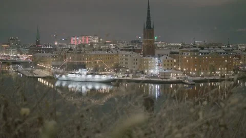 Nighttime Cityscape with Reflections in Water Stock Footage 326225317