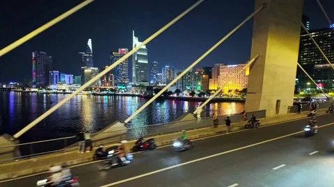 Nighttime cityscape through cable-stayed bridge shows Saigon Stock Footage 294745755