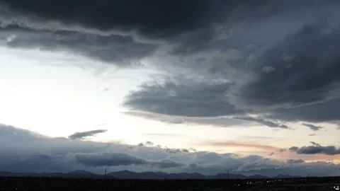 Nighttime Clouds Timelapse with Mountains in Background Stock Footage 131788230