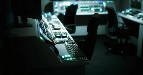Nighttime control room with advanced tech for efficient operations Stock Illustration