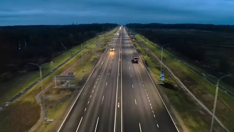 Nighttime crosswalk over the freeway. Tranquil Highway Passage Through Autumnal Stock Footage 257776772