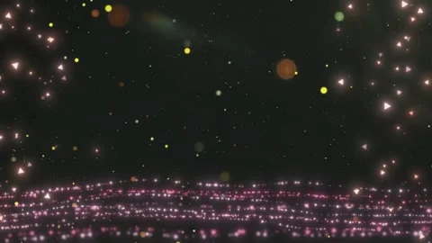Nighttime Crowd Gathering with Sparkling Lights in Dark Outdoor Setting Video stock 337527511