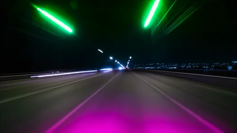 Nighttime Drive Through Illuminated Road Lights With Motion Blur Effects. Stock Footage 294528429