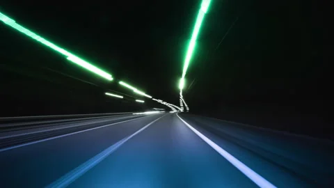 Nighttime Drive Through Illuminated Road Lights With Motion Blur Effects Stock Footage 317312229